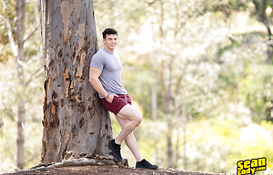 Hunky gay bodybuilder Clark Reid flashes his ass outdoors before posing naked