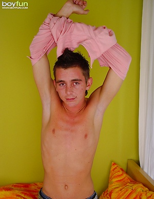 Smooth twink Joseph busts a nut all over his stomach.